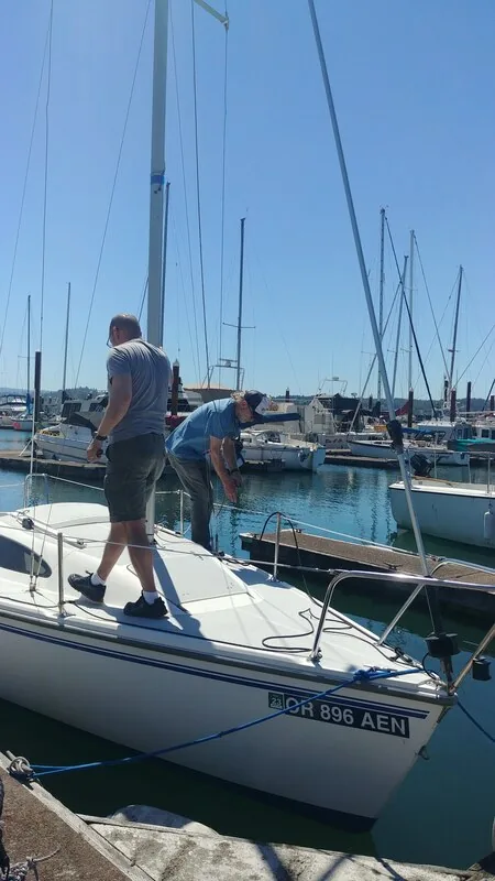 Club members working aboard Fulmar at the dock