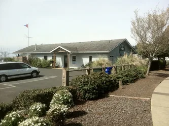 Exterior view of the clubhouse and landscaping Exterior view of the clubhouse and landscaping